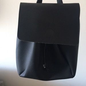 Black faux leather flap backpack